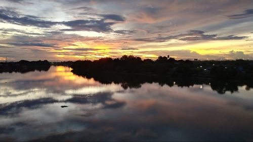 Scenic view of lake against sky during sunset