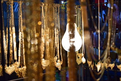 Close-up of illuminated chandelier hanging at night