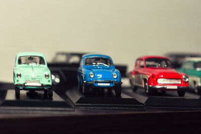 Close-up of toy cars on road