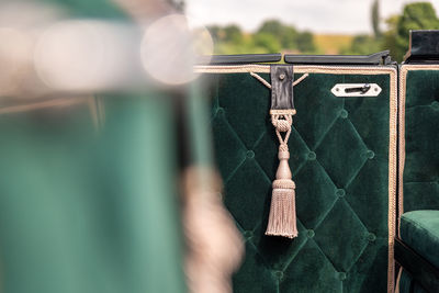 A cord in the interior of a carriage.