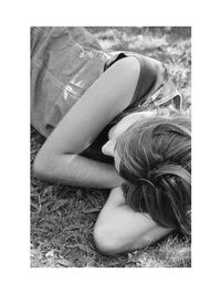 High angle view of woman lying down on floor