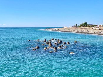 Scenic view of sea against clear blue sky