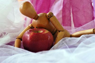 Close-up of apples on bed
