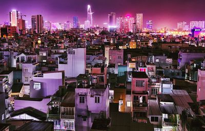 High angle view of city lit up at night