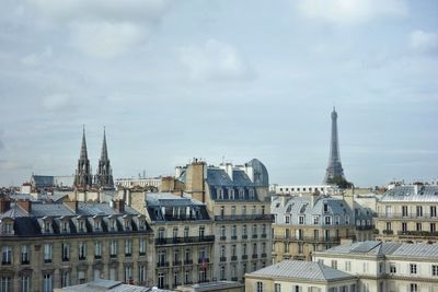 Buildings in city against sky