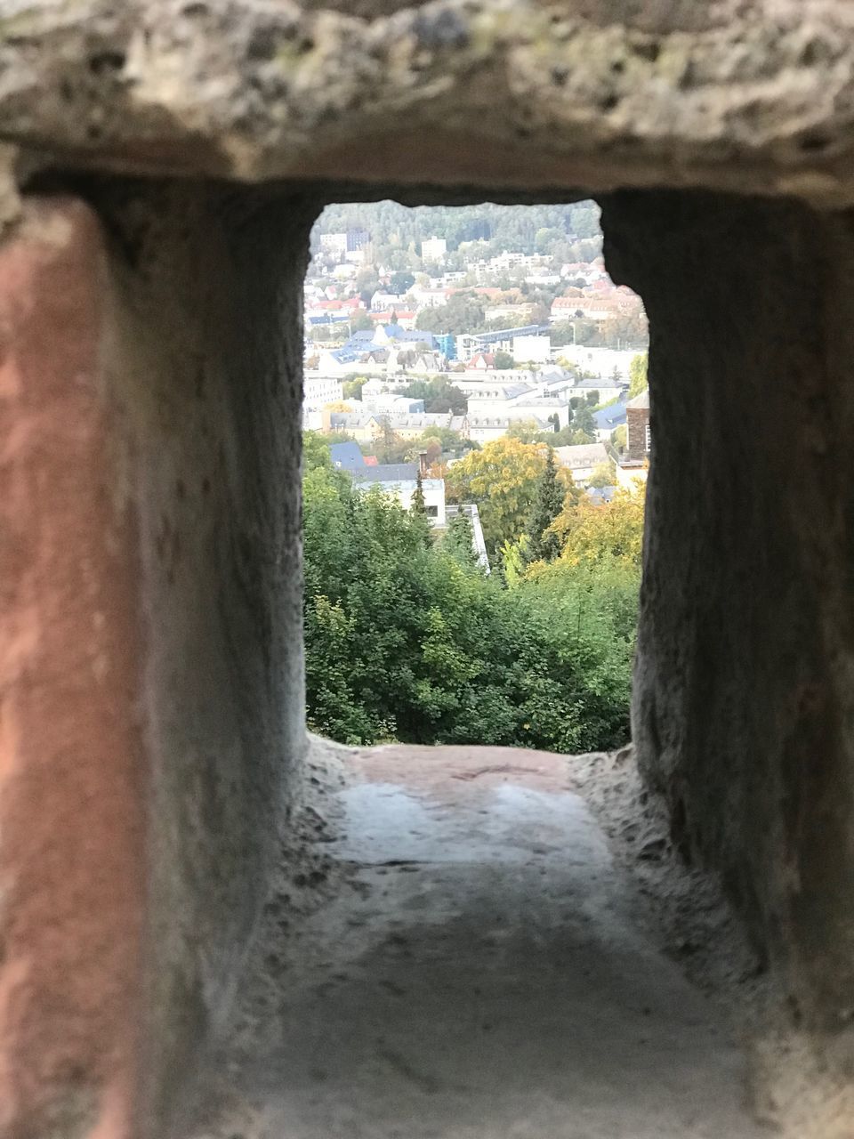 CLOSE-UP OF STONE WALL BY WINDOW