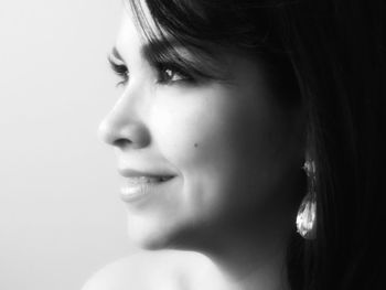 Close-up of young woman over white background