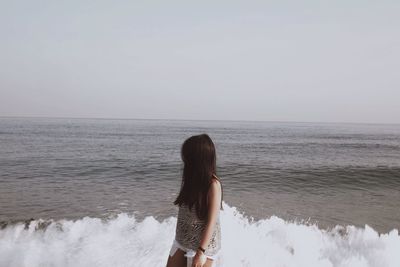 Woman standing on beach