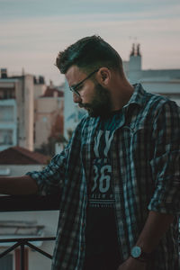 Young man looking away outdoors