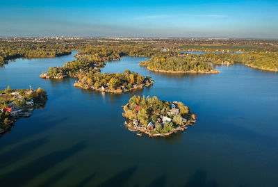 High angle view of trees by sea against sky