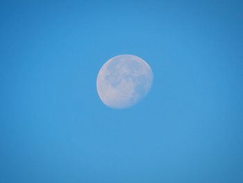 Close-up of moon against blue sky