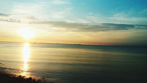 Scenic view of sea against sky at sunset