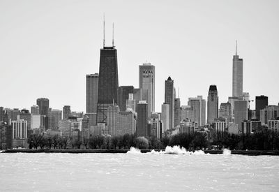 View of city during winter against sky