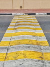 High angle view of yellow zebra crossing on road