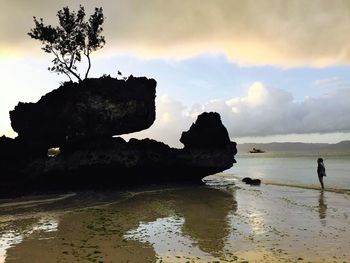 Scenic view of sea against cloudy sky
