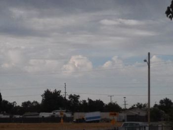 View of road against cloudy sky