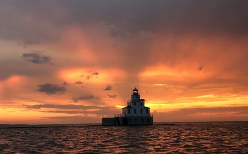 Scenic view of sea against orange sky