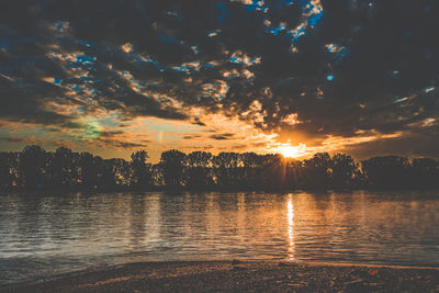 Reflection of clouds in water at sunset