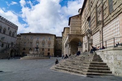 Group of people in front of historical building