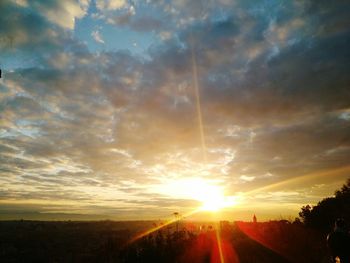 Silhouette landscape against sky during sunset