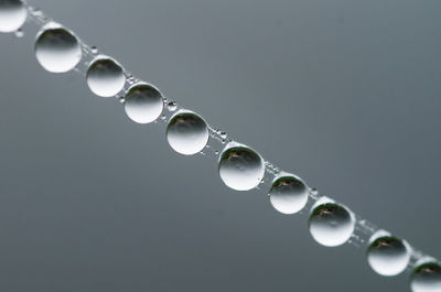 Low angle view of water drops on metal