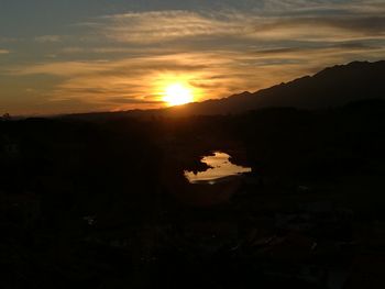 Scenic view of mountains against sky during sunset