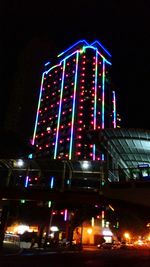 Low angle view of illuminated lights at night