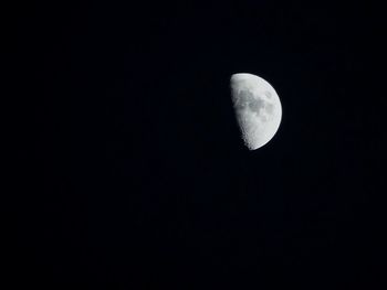 Low angle view of moon against clear sky at night