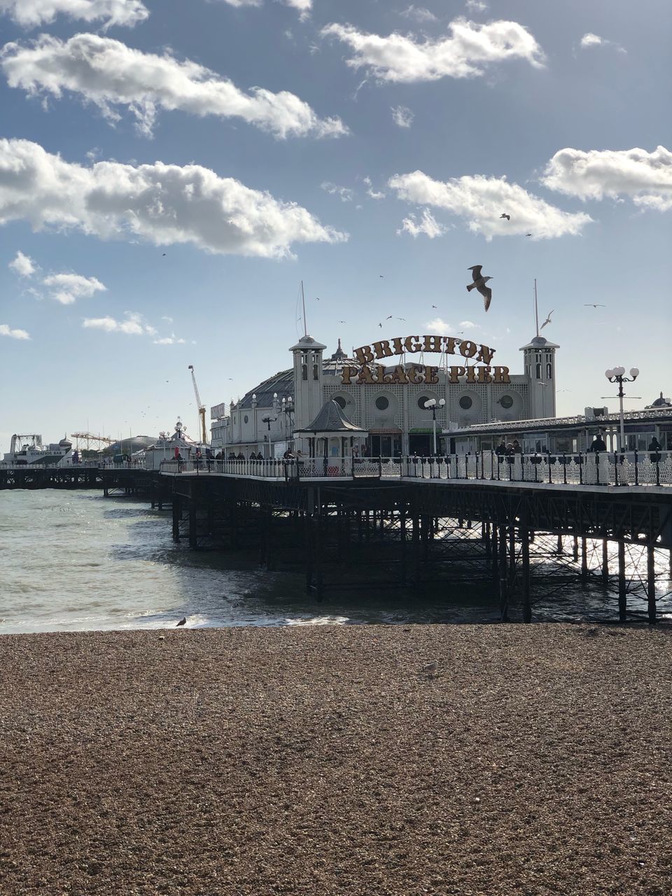 PIER OVER SEA AGAINST BUILDINGS IN CITY