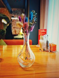 Close-up of glass vase on table at home