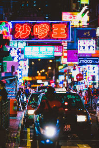 Illuminated city street at night