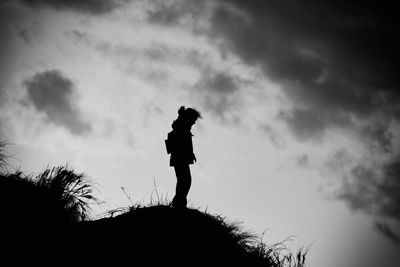 Side view of a silhouette man against sky