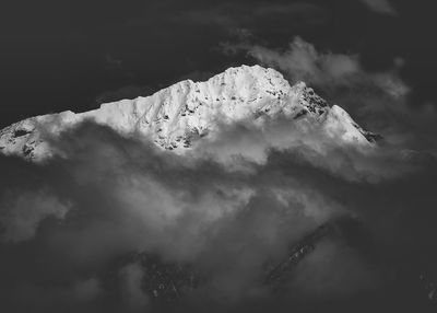 Scenic view of snow covered mountain against sky