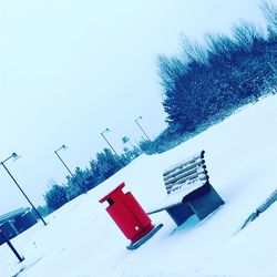 Snow covered tree against sky