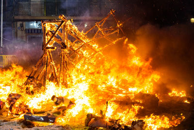 Low angle view of fire crackers at night