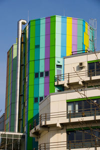 Low angle view of multi colored built structure against sky