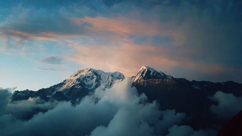 Scenic view of snowcapped mountains against sky