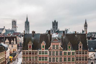 Buildings in city against sky
