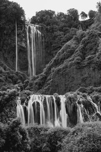 Arch bridge over waterfall