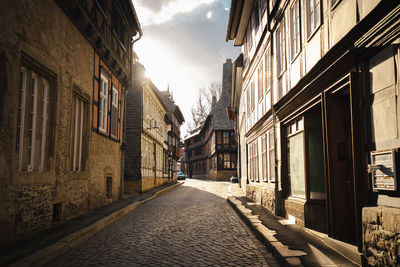 Narrow alley amidst buildings in city