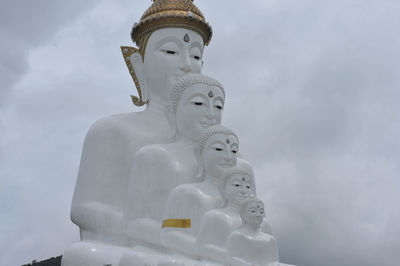 Low angle view of statue against sky