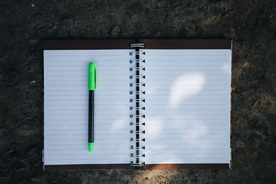 High angle view of pen on table against wall