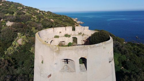 Scenic view of sea and buildings against sky