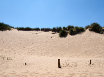 Scenic view of desert against clear sky