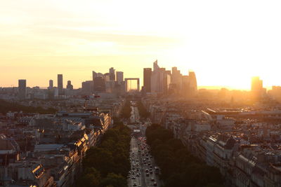 Aerial view of city against sky during sunset