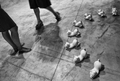 Low section of woman standing on tiled floor