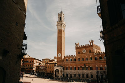 Buildings in city against sky