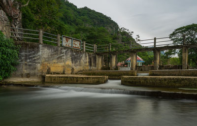 Bridge over river against sky
