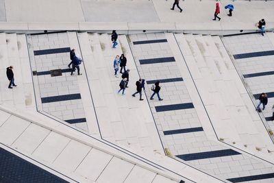 High angle view of people walking on road