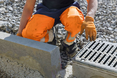 Low section of man working at construction site